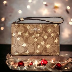 Coach Signature canvas and gold stars corner zip wristlet